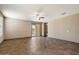 Bright living room with sliding glass doors to the backyard and neutral paint at 13612 W Desert Moon Way, Peoria, AZ 85383