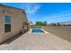 Private backyard pool with patio area and ample space for outdoor activities and entertaining at 13612 W Desert Moon Way, Peoria, AZ 85383