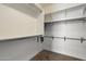 Organized walk-in closet with ample shelving and hanging space, ready for all your storage needs at 13612 W Desert Moon Way, Peoria, AZ 85383