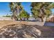 Spacious gravel backyard with a few trees and a block wall at 1368 W 14Th St, Tempe, AZ 85281