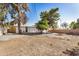 Spacious gravel backyard with mature trees and block wall at 1368 W 14Th St, Tempe, AZ 85281