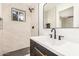 Modern bathroom featuring white marble tile and black fixtures at 1368 W 14Th St, Tempe, AZ 85281