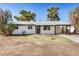 Single-story home with a dark-trimmed roofline and well-maintained yard at 1368 W 14Th St, Tempe, AZ 85281