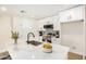 Bright kitchen featuring white cabinets, stainless steel appliances, and marble-look countertops at 1368 W 14Th St, Tempe, AZ 85281