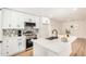 Bright, renovated kitchen with white cabinets, stainless appliances, and designer backsplash at 1368 W 14Th St, Tempe, AZ 85281
