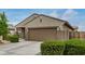 Single-story home featuring desert landscaping, and an attached two-car garage at 17573 W Via De Luna Dr, Surprise, AZ 85387