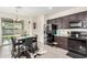 Bright and airy kitchen featuring modern appliances, plenty of counter space, and a cozy dining area at 17573 W Via De Luna Dr, Surprise, AZ 85387