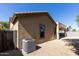 Backyard exterior showing covered patio, gravel landscaping, and house exterior at 18391 W Stinson Dr, Surprise, AZ 85374