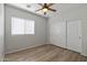 Bedroom with a ceiling fan, closet and window provides ample natural light at 18391 W Stinson Dr, Surprise, AZ 85374