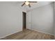 This bright, airy bedroom features hard surface floors and a view to the ensuite at 18391 W Stinson Dr, Surprise, AZ 85374