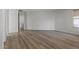 This bedroom boasts wood-look flooring and neutral walls at 18391 W Stinson Dr, Surprise, AZ 85374
