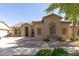 Charming single-story home featuring stucco siding, tile roof, desert landscaping, and inviting curb appeal at 18391 W Stinson Dr, Surprise, AZ 85374