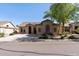 Charming single-story home featuring a tile roof, neutral stucco, and desert landscaping at 18391 W Stinson Dr, Surprise, AZ 85374