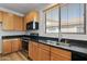 This modern kitchen features stainless steel appliances, ample cabinet space, and granite countertops at 18391 W Stinson Dr, Surprise, AZ 85374