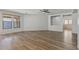 Bright living room offers wood floors and neutral paint colors plus natural light from the windows at 18391 W Stinson Dr, Surprise, AZ 85374