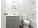 Bathroom with modern gray vanity, new fixtures, and shower over tub provides a comfortable experience at 2018 W Western Dr, Chandler, AZ 85224