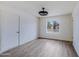 Bedroom with wood-look floors, modern light, and a bright window; ideal for relaxation and comfort at 2018 W Western Dr, Chandler, AZ 85224