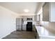 Remodeled kitchen features gray cabinets, stainless appliances, and quartz countertops at 2018 W Western Dr, Chandler, AZ 85224