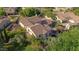 Aerial view of the backyard, featuring mature trees and outdoor living spaces at 20638 W Main St, Buckeye, AZ 85396