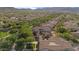 Aerial view showcases the property within a community with lush landscaping and trees at 20638 W Main St, Buckeye, AZ 85396