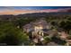 Aerial shot of a beautiful home nestled within a lush green neighborhood, showcasing its large backyard at 20638 W Main St, Buckeye, AZ 85396