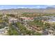 Scenic aerial view of the community featuring lush landscaping, fountains, and mountain views at 20638 W Main St, Buckeye, AZ 85396