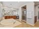 Large bathroom with soaking tub, step in shower, and double vanity at 20638 W Main St, Buckeye, AZ 85396