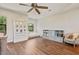 Bright bedroom featuring hardwood floors, built-in shelving, window seat, and a quaint decor at 20638 W Main St, Buckeye, AZ 85396