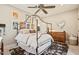 Charming bedroom with a canopy bed, eclectic artwork, and a stylish, decorative rug at 20638 W Main St, Buckeye, AZ 85396