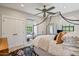 Cozy bedroom showcases a four-poster bed, natural light, and ample closet space at 20638 W Main St, Buckeye, AZ 85396