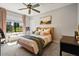 Inviting bedroom features a comfortable bed, window bench, and an ample amount of natural light at 20638 W Main St, Buckeye, AZ 85396