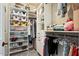 Organized walk-in closet with custom shelving, storage solutions, and ample hanging space at 20638 W Main St, Buckeye, AZ 85396