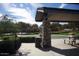 Community park featuring a shaded pavilion with picnic tables and a basketball court at 20638 W Main St, Buckeye, AZ 85396