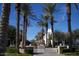 Beautiful community featuring lush landscaping, elegant architecture, and a tranquil fountain centerpiece at 20638 W Main St, Buckeye, AZ 85396