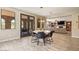 Bright dining room area featuring a modern chandelier, gray accent doors, and elegant decor at 20638 W Main St, Buckeye, AZ 85396