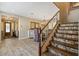 Inviting entryway featuring decorative stairs leading to a dining area illuminated by a chandelier at 20638 W Main St, Buckeye, AZ 85396
