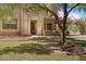 Beautiful home with a well-maintained front yard, mature trees, and appealing curb appeal at 20638 W Main St, Buckeye, AZ 85396