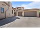 Spacious three-car garage with ample parking space and a well-maintained driveway at 20638 W Main St, Buckeye, AZ 85396