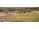 Picturesque view of a lush golf course winding through the neighborhood with scenic surroundings at 20638 W Main St, Buckeye, AZ 85396