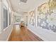 Hallway with wood floors and wall art at 20638 W Main St, Buckeye, AZ 85396