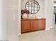 Hallway with wall art, wood floors and hall storage at 20638 W Main St, Buckeye, AZ 85396