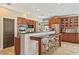 Modern kitchen boasts breakfast bar seating, providing seamless connectivity to dining and entertaining spaces at 20638 W Main St, Buckeye, AZ 85396