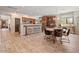 Open-concept living area with a dining table, breakfast bar, and access to the kitchen at 20638 W Main St, Buckeye, AZ 85396