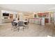 Open floor plan featuring a dining area, living space with a fireplace, and a bar top with stools at 20638 W Main St, Buckeye, AZ 85396