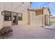 Inviting covered patio area with brick pavers and string lights, perfect for outdoor entertaining and relaxing at 20638 W Main St, Buckeye, AZ 85396