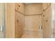 Step in shower with tile surround and built in bench at 20638 W Main St, Buckeye, AZ 85396