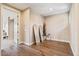 Versatile spare room with wood floors, natural light, and minimalist decor, perfect for customization at 20638 W Main St, Buckeye, AZ 85396
