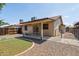 View of the backyard with a patio, artificial turf, and a gravel-covered area at 20644 N 30Th Dr, Phoenix, AZ 85027