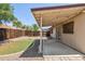 A backyard featuring an artificial lawn, concrete patio and perimeter fence at 20644 N 30Th Dr, Phoenix, AZ 85027