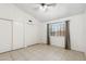 An empty bedroom with white walls, tile flooring, and closet at 20644 N 30Th Dr, Phoenix, AZ 85027